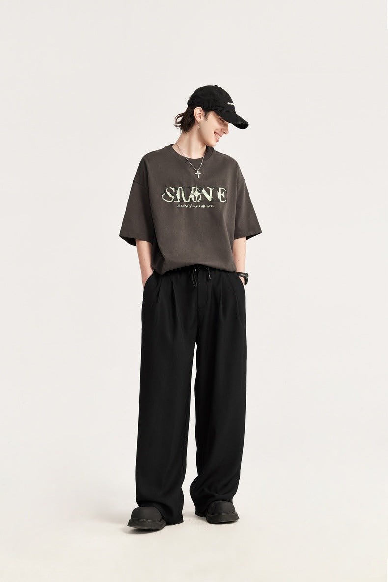 Stylish men's pleated trousers with comfortable wide leg & adjustable drawstring waist.