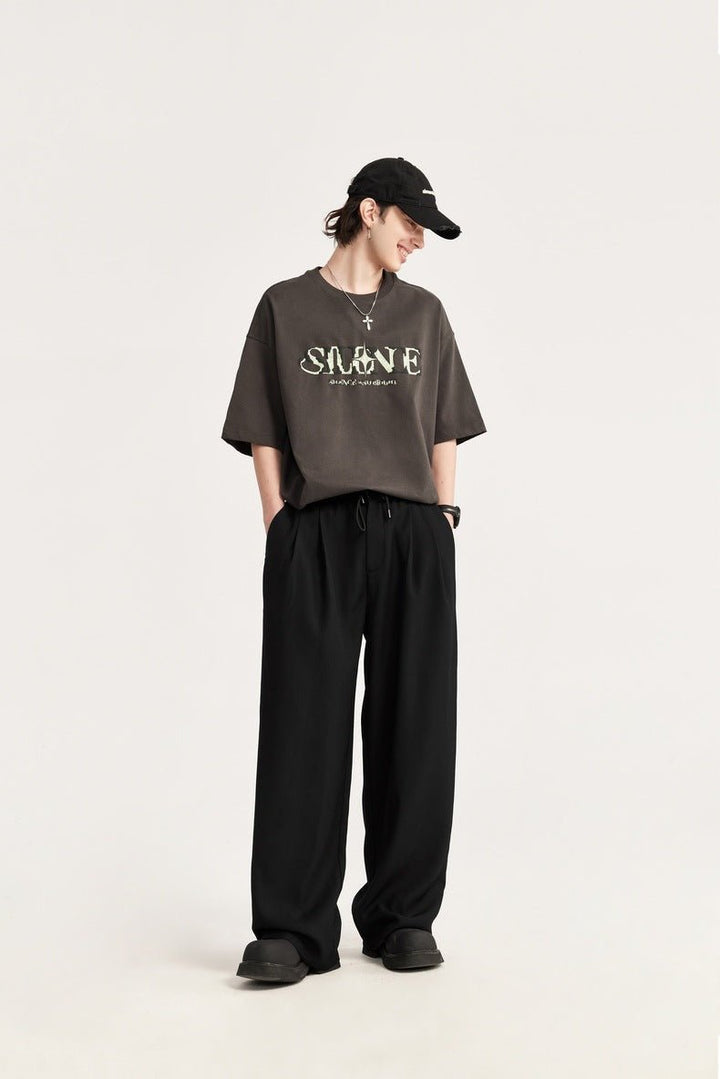 Stylish men's pleated trousers with comfortable wide leg & adjustable drawstring waist.
