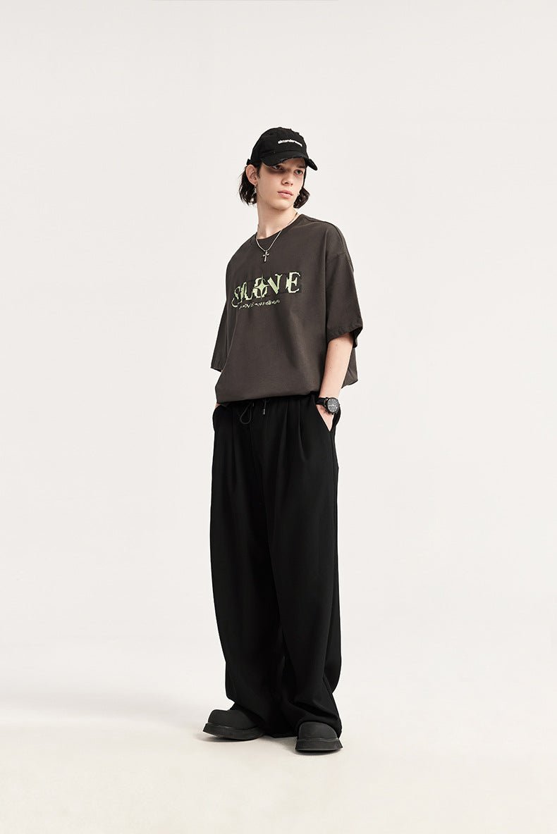 Modern men's drawstring trousers. Pleated front, wide leg design offers ultimate comfort & style.