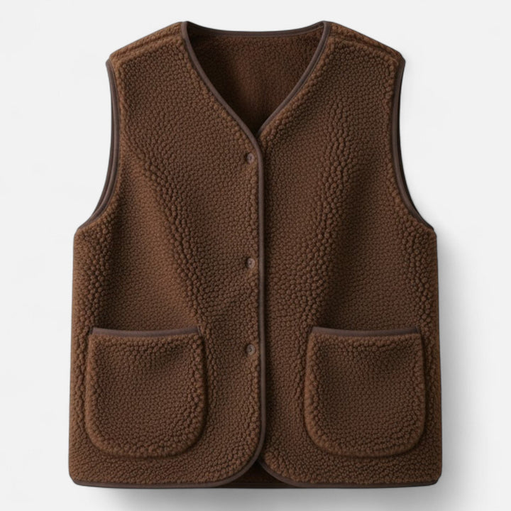 Button-front men's plush knit vest. Versatile cashmere-style layering piece for a refined and comfortable look.