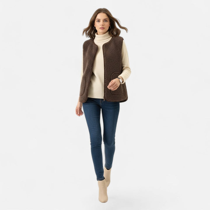 Refined men's sleeveless plush knit vest. Luxurious cashmere-style texture adds elegance to any layered outfit.