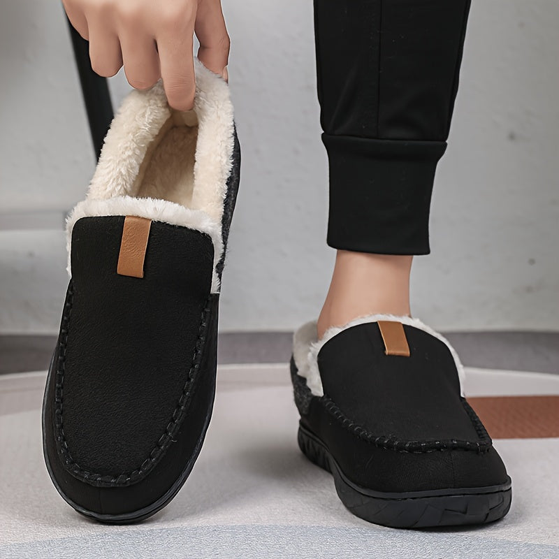 Stylish men's indoor slippers, plush and warm, with a protective non-slip sole for cozy footing.