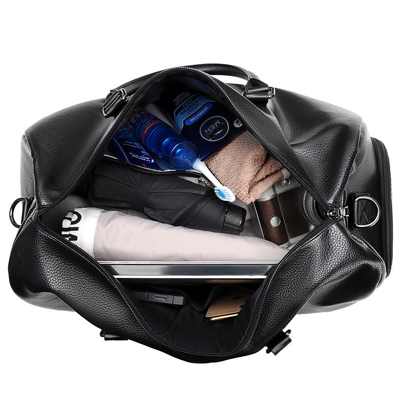 Stylish men's black leather overnight bag, a versatile premium duffle for sophisticated travelers.