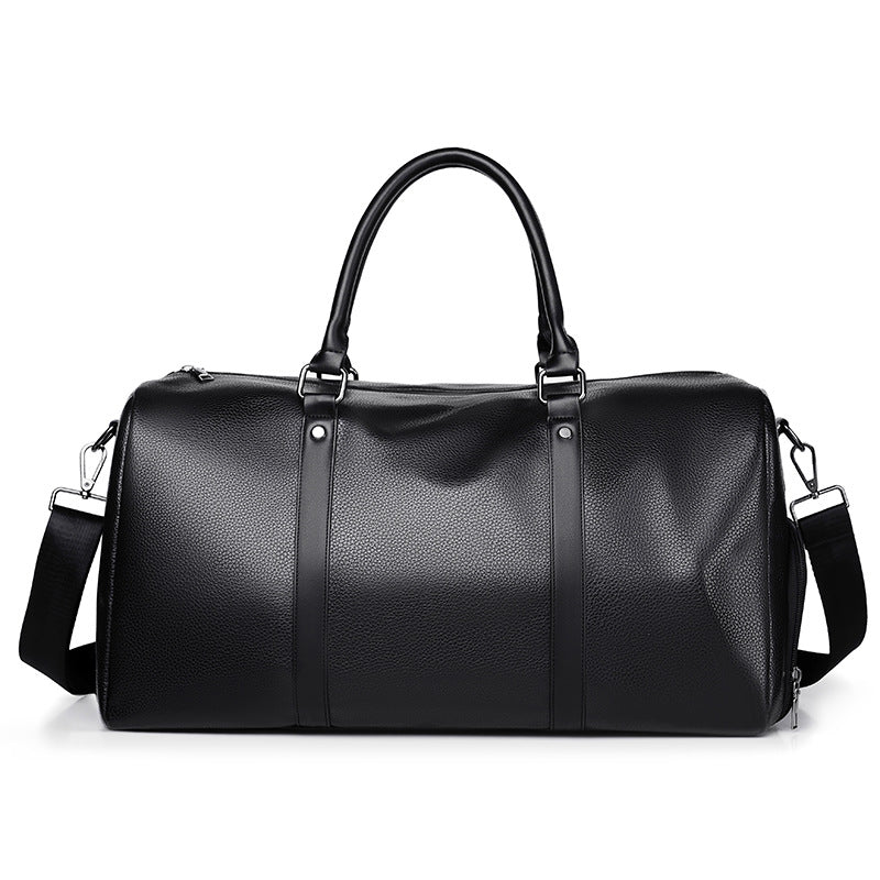 Close-up of premium men's black leather duffle bag, highlighting its fine texture and craftsmanship.