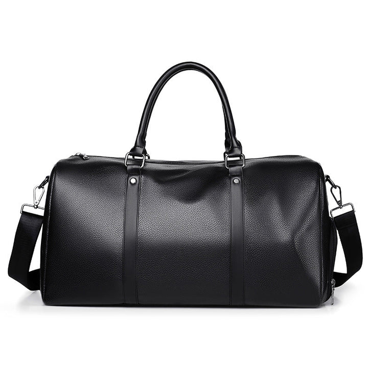 Close-up of premium men's black leather duffle bag, highlighting its fine texture and craftsmanship.