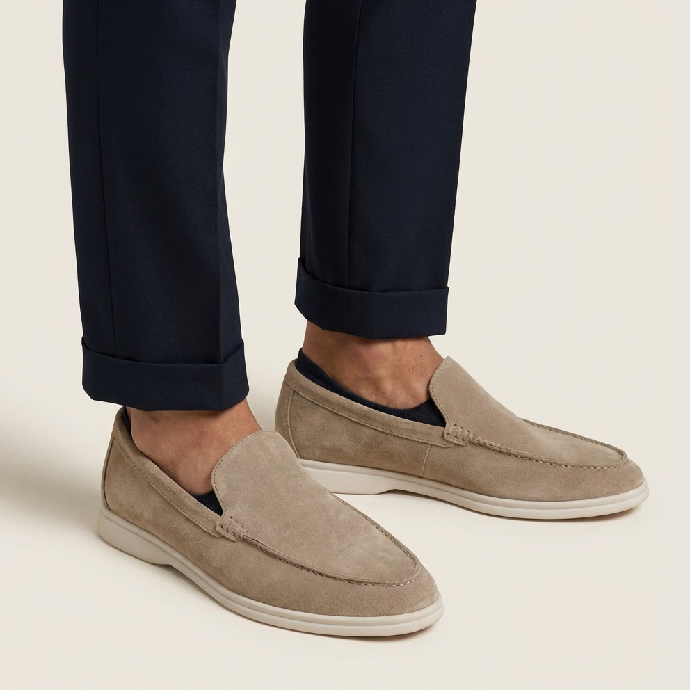 Close-up of texture on men's premium leather loafers, emphasizing quality & comfort.