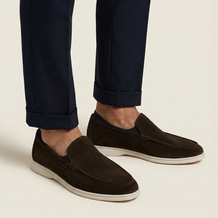 Sleek side profile of classic men's slip-on loafers, perfect for dress or casual outfits.