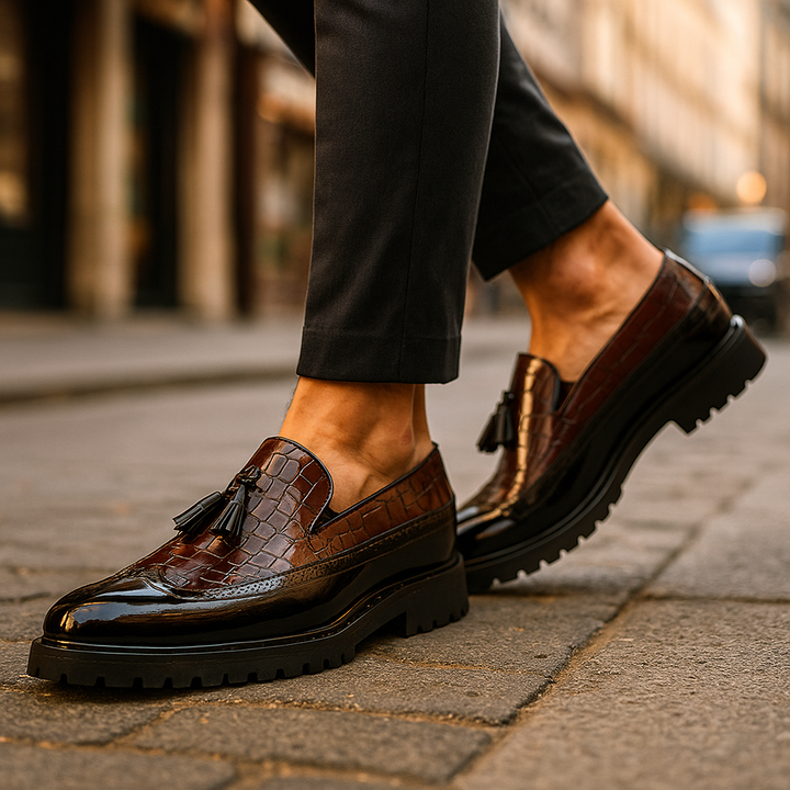 Premium men's slip-on loafers featuring a distinct croc-embossed pattern and elegant tassel detail.
