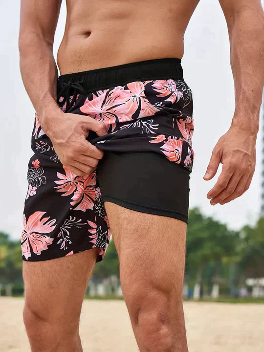 Trendy men's printed beachwear swim trunks with drawstring for summer style.