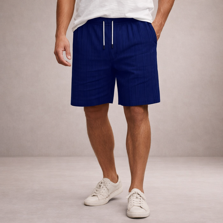 Relaxed fit men's printed shorts, comfortable drawstring waist. Ideal for warm weather & leisure.