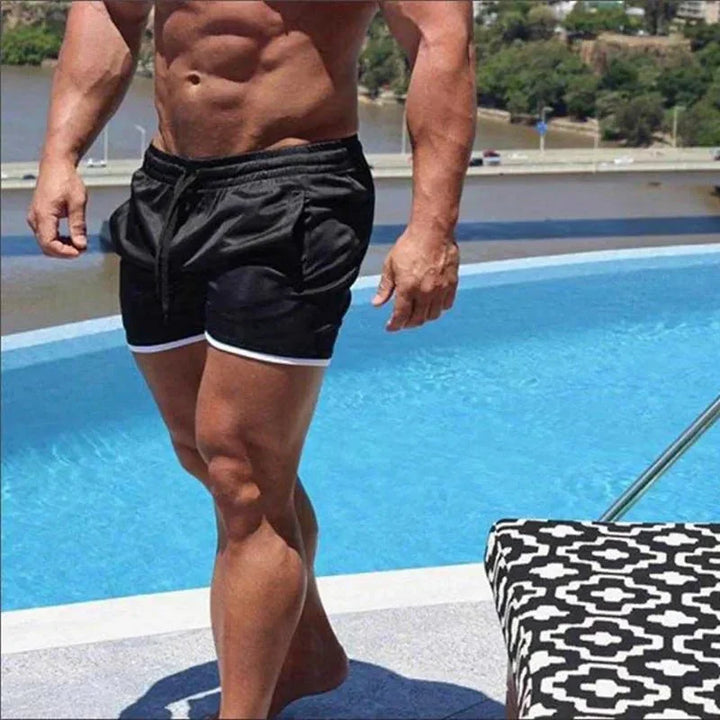 Men's athletic swim shorts, quick-dry material & mesh lining for swimming, surfing, or beach volleyball.