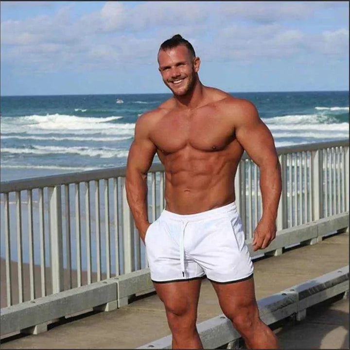Durable men's quick-dry swim trunks, athletic fit, mesh lining for ultimate comfort in water. Beach-ready.