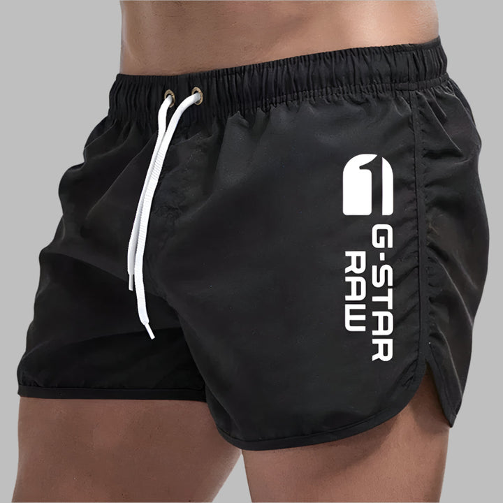 Comfortable men's quick-dry swim trunks. Ideal athletic shorts for travel, beach, and pool swimwear.