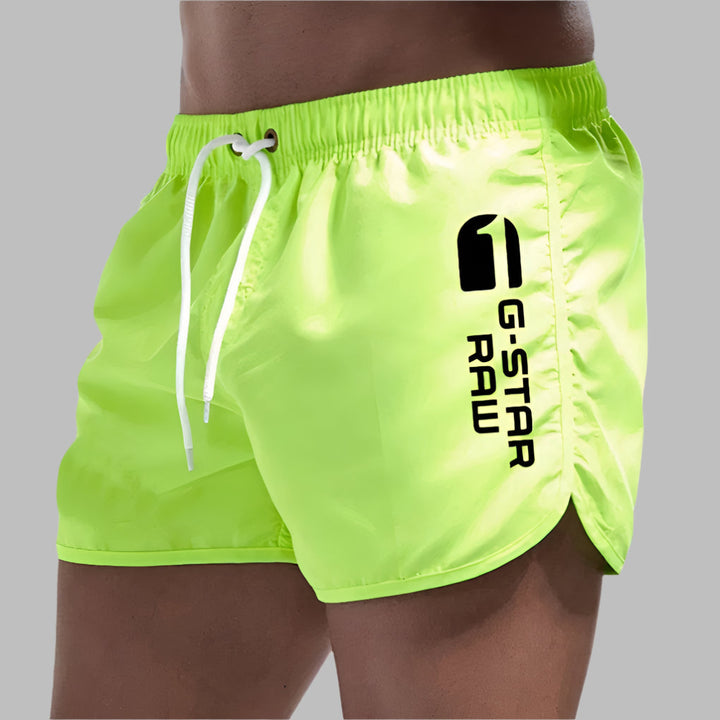 Solid color men's quick-dry swim trunks, versatile for beach, pool, and athletic summer wear.