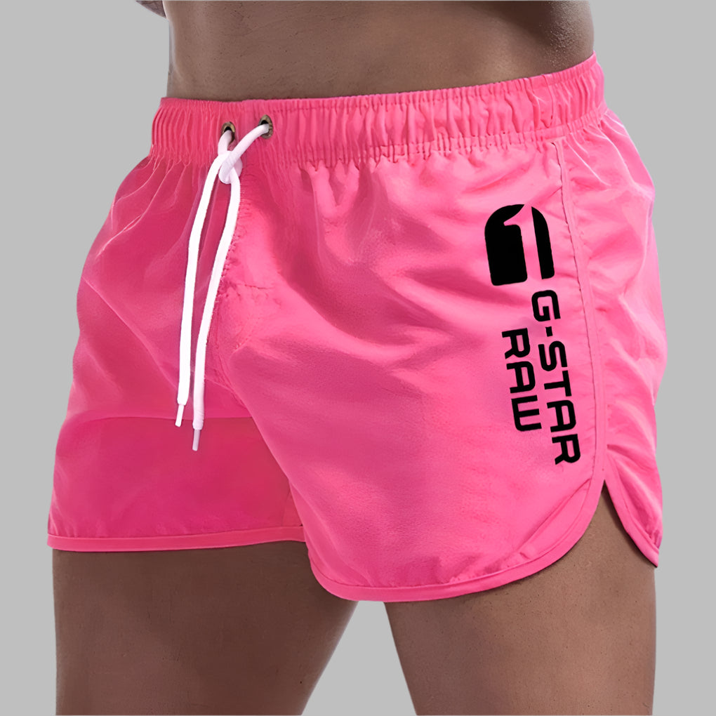 Men's quick-dry swim trunks. Solid color athletic beachwear shorts for comfortable pool & summer travel.