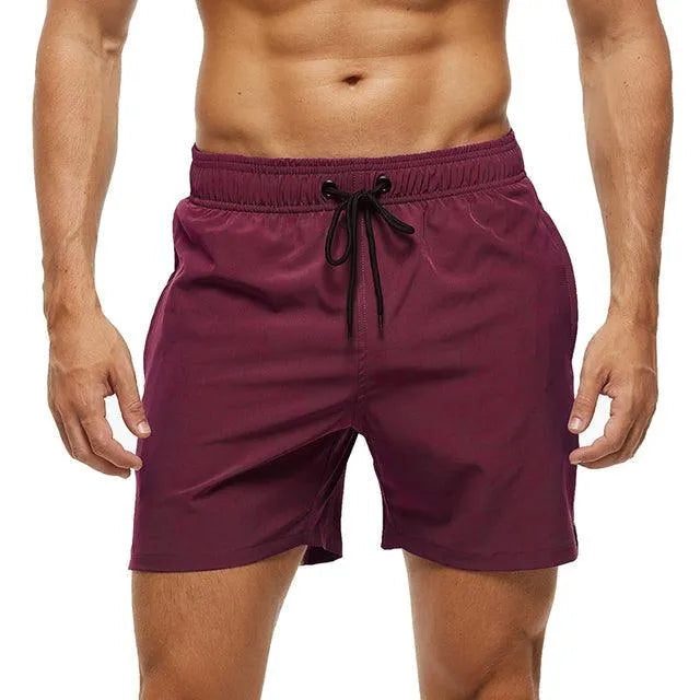 Stylish men's beach shorts with drawstring, ideal for vacation, pool wear, and casual summer fashion.