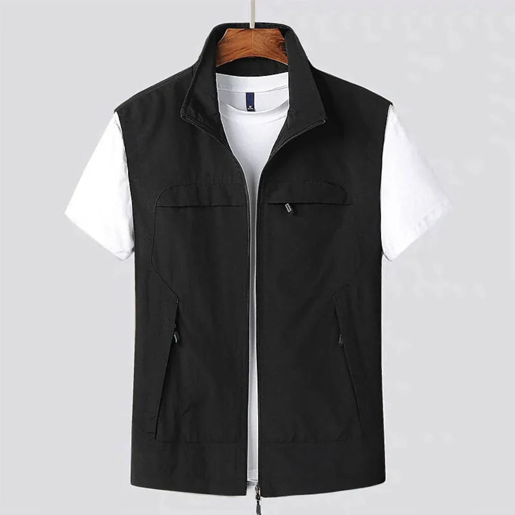 Functional men's utility vest with multi-pockets, quick-dry fabric, perfect for outdoor activities & travel.