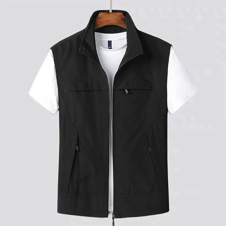 Functional men's utility vest with multi-pockets, quick-dry fabric, perfect for outdoor activities & travel.