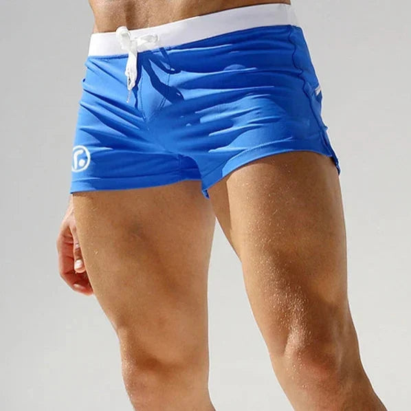 Men's quick-dry stretch swim trunks, ultimate comfort fit for summer beachwear and active pool shorts.