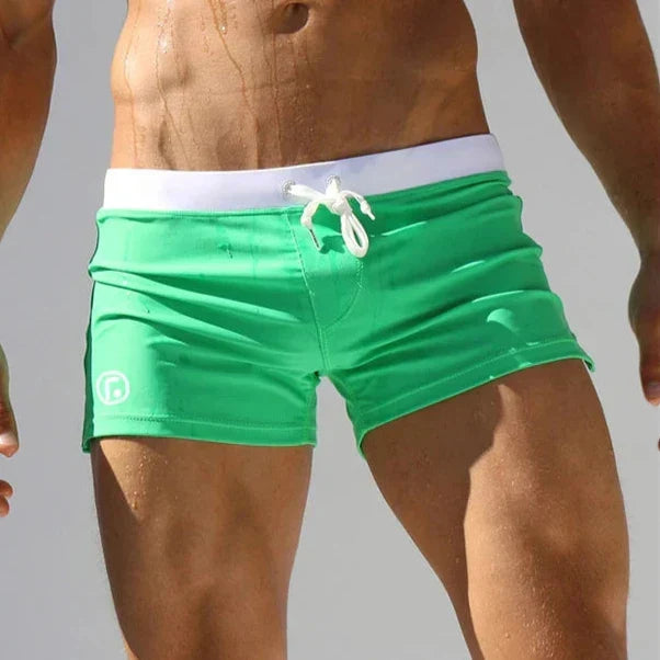 Modern men's quick-dry swim trunks, stretch comfort fit for performance, beach, and casual summer fashion.