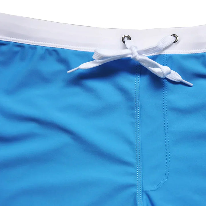 Men's quick-dry stretch swim trunks for comfort fit. Perfect for beachwear, pool, and active summer.