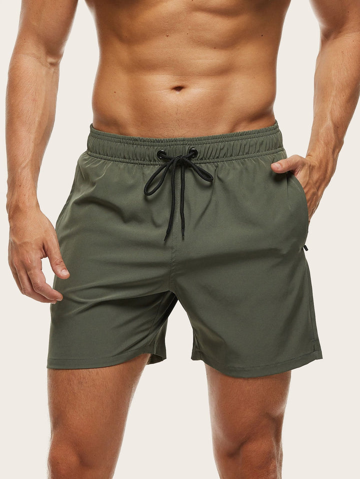 Men's quick-dry swim shorts with elastic waist, stretch comfort for beach & pool.
