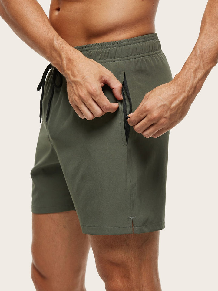 High-performance men's quick-dry swim shorts, stretch fabric for maximum movement at beach/pool.