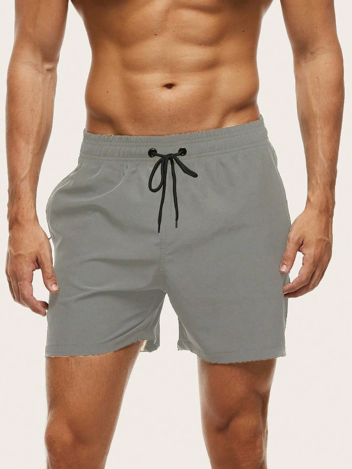 Men's vacation essential: quick-dry stretch swim trunks for beach, pool, and active travel.