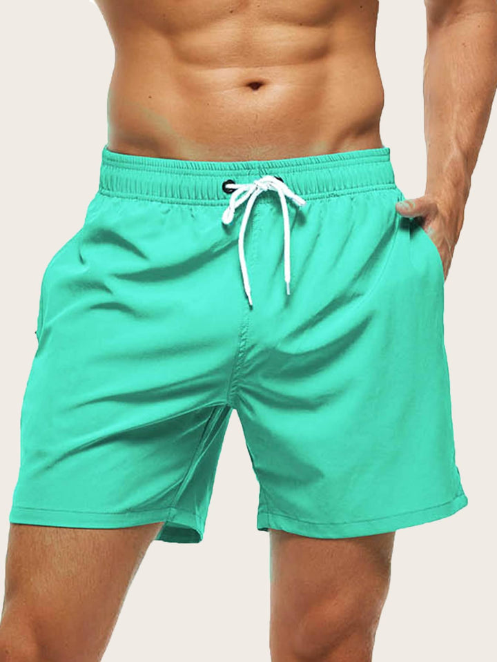 Easy-care quick-dry men's swim shorts, lightweight stretch design for beach & pool.