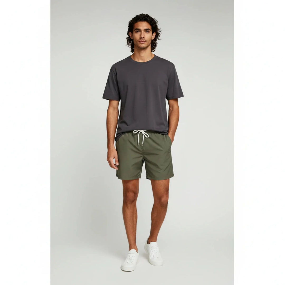 Men's quick-dry swim trunks, perfect for beach & pool, featuring an elastic waist for comfort.
