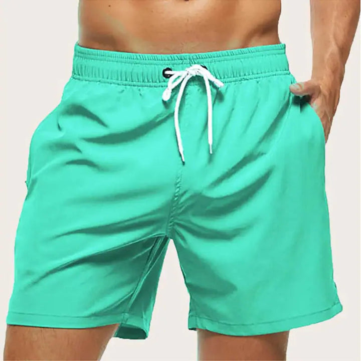 Comfortable men's quick-dry swim trunks, great for active wear or relaxing by the poolside.