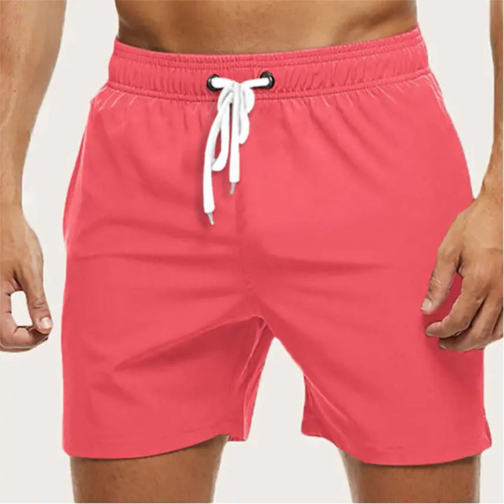 Elastic waist men's swim trunks, quick-dry fabric, perfect beach shorts for active summer days.