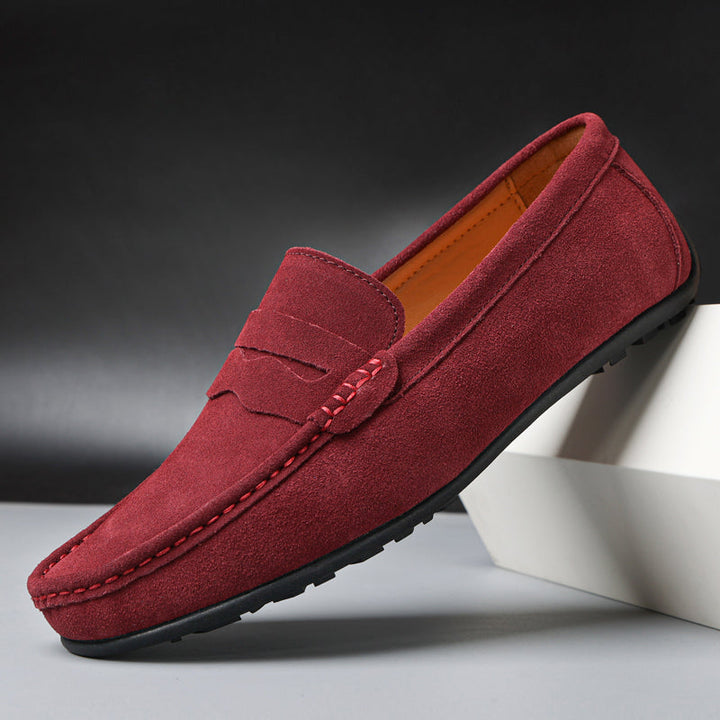 Stylish men's penny loafers featuring a classic slot, ideal smart-casual slip-on footwear.