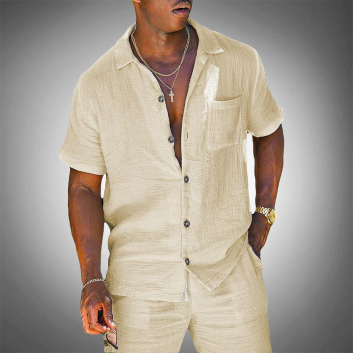 Stylish white men's relaxed fit shirt and trouser set, ideal for versatile day-to-evening summer outfits.