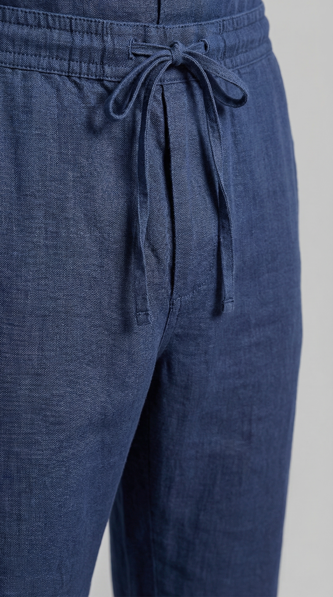 Men's travel outfit: a versatile relaxed co-ord set featuring a breathable shirt & comfortable trousers.