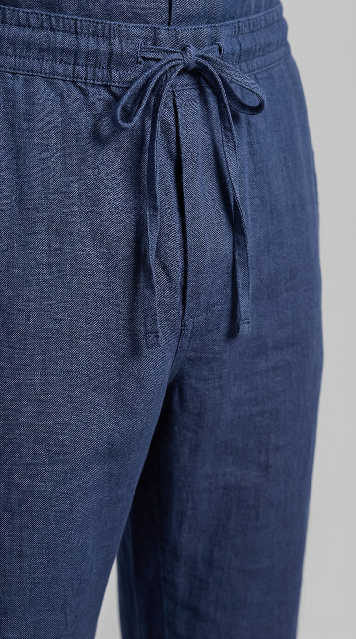 Men's travel outfit: a versatile relaxed co-ord set featuring a breathable shirt & comfortable trousers.