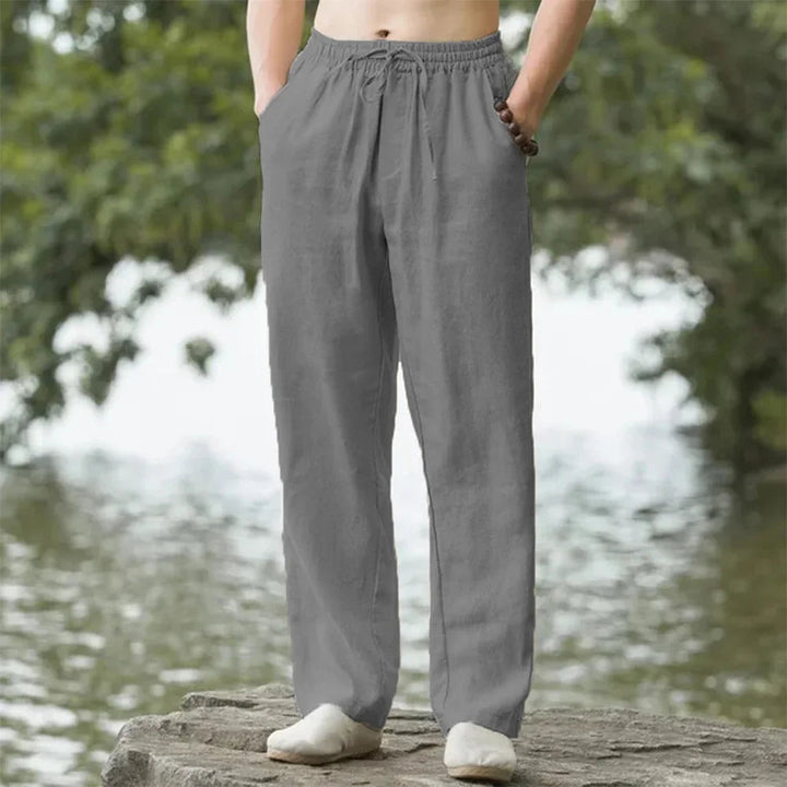 Comfortable men's relaxed beach pants with drawstring waist for summer travel & casual wear.