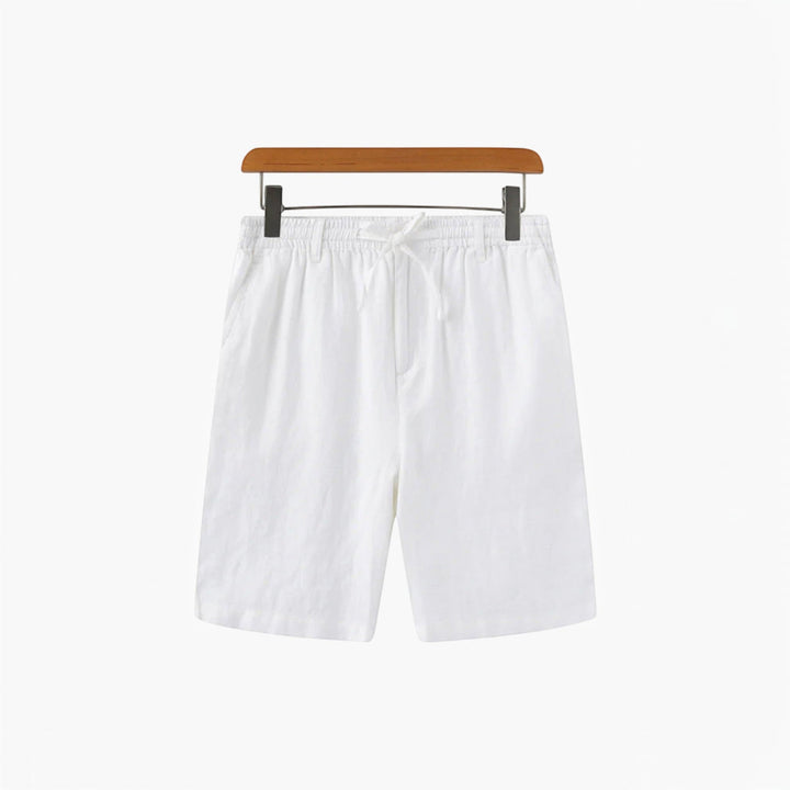 Stack of men's relaxed fit beach shorts, ready for a warm weather vacation & travel.