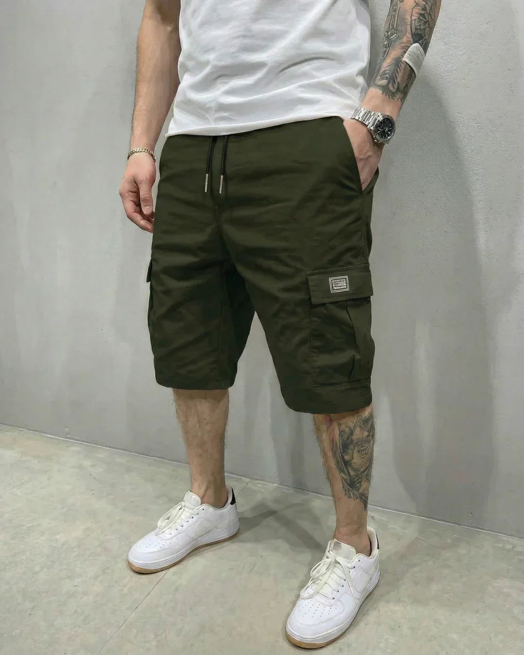 Close-up of men's comfortable cargo shorts featuring a drawstring waist and practical flap pockets.