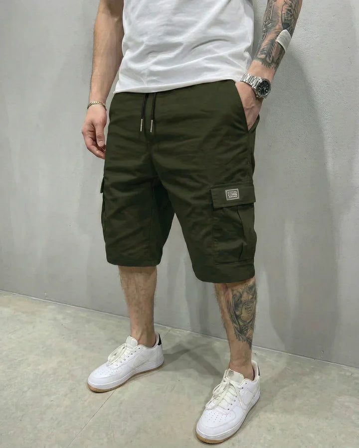 Close-up of men's comfortable cargo shorts featuring a drawstring waist and practical flap pockets.