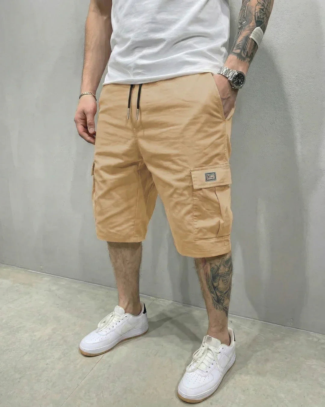 Versatile men's utility shorts in khaki with a comfortable drawstring waist and secure flap pockets.
