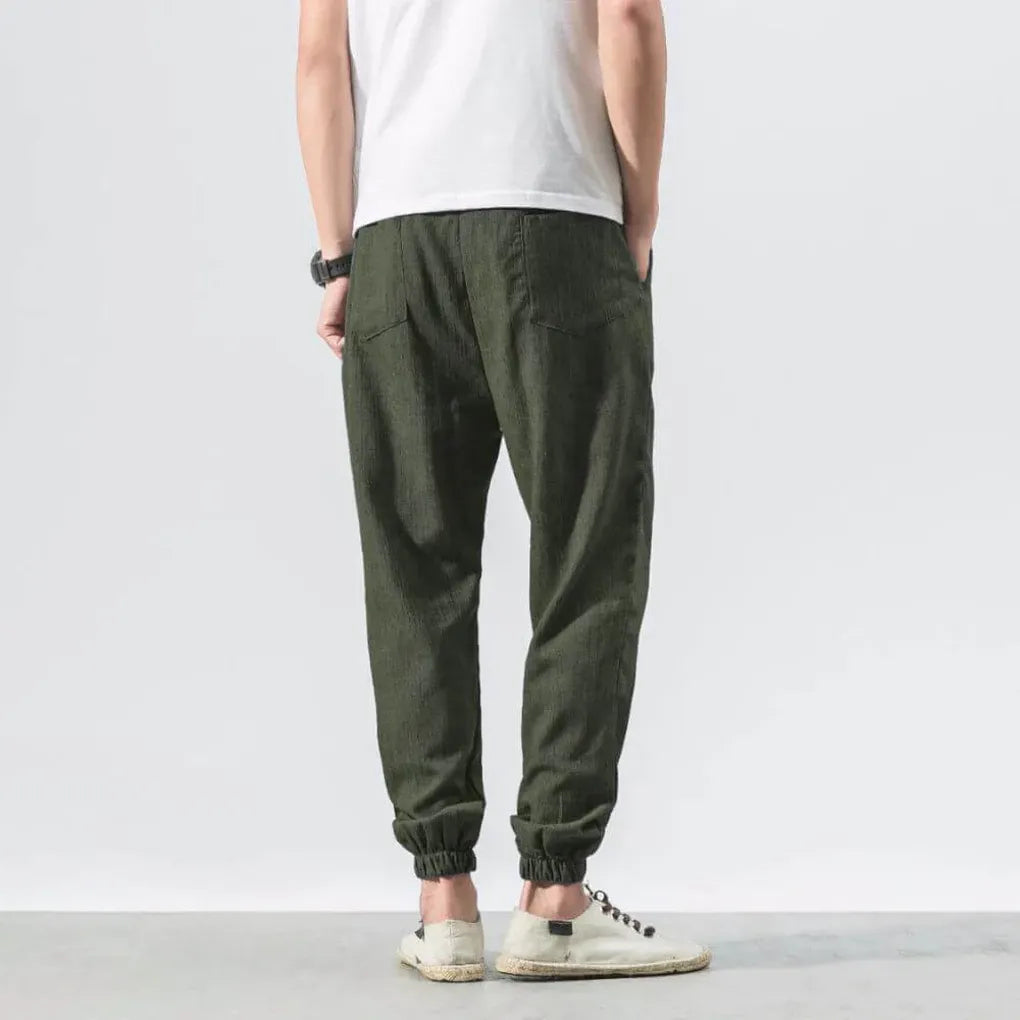 Versatile men's summer pants with a comfortable relaxed fit and functional drawstring waist.