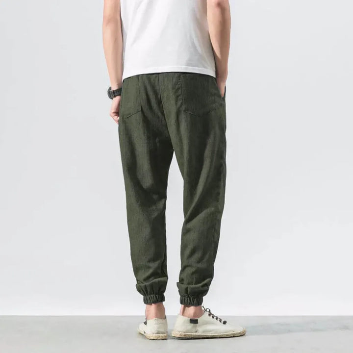 Versatile men's summer pants with a comfortable relaxed fit and functional drawstring waist.