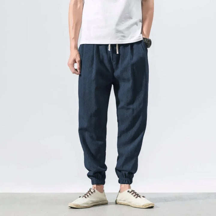 Light summer pants for men, relaxed fit, offering superior breathability and comfort.