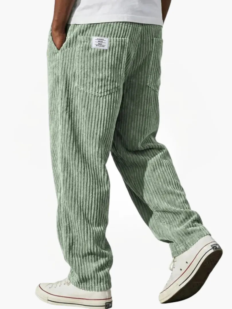 Detail of the soft corduroy fabric on men's relaxed fit trousers, showcasing the practical drawstring waist.