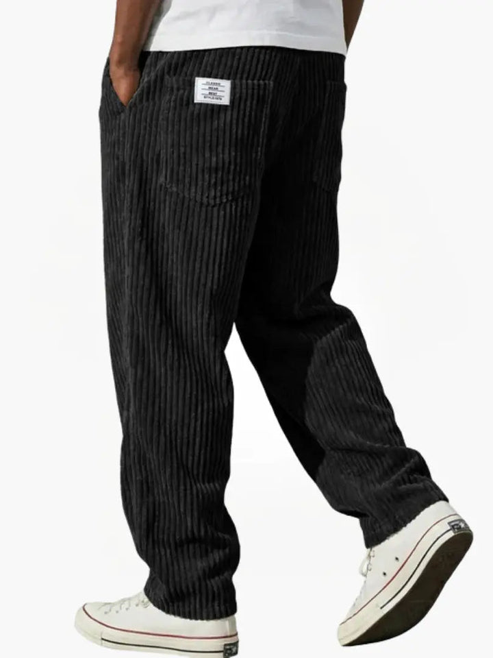 Versatile men's corduroy trousers, relaxed fit and drawstring closure, offering ultimate comfort for daily wear.