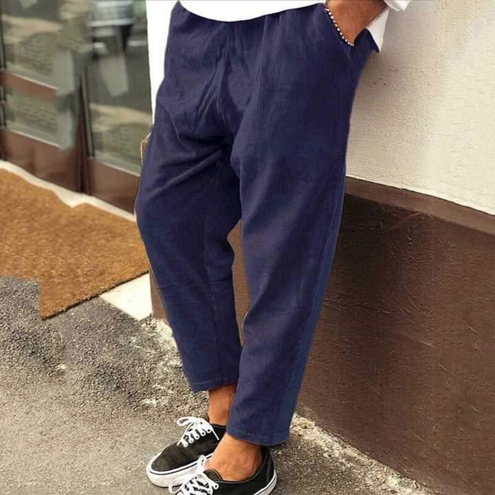 Comfortable men's relaxed fit corduroy pants with drawstring waist, ideal for versatile everyday wear.