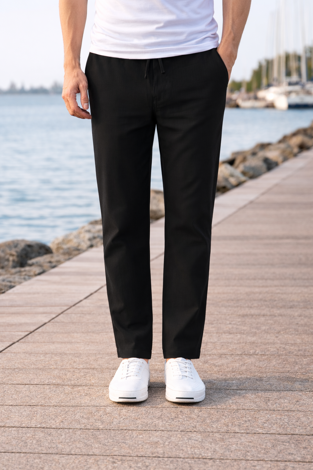 Relaxed fit men's cotton trousers with drawstring waist, ideal for daily comfort.