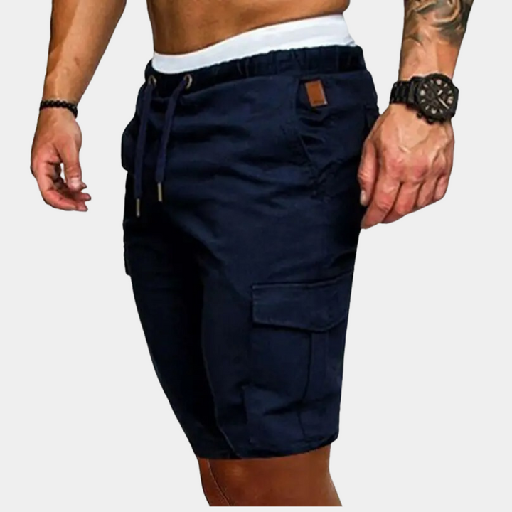 Close-up of men's utility cargo shorts featuring a comfortable drawstring waist and practical side pockets.