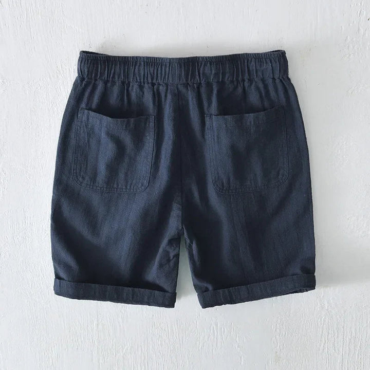 Men's relaxed fit knee-length drawstring shorts in a comfortable fabric for summer fashion.